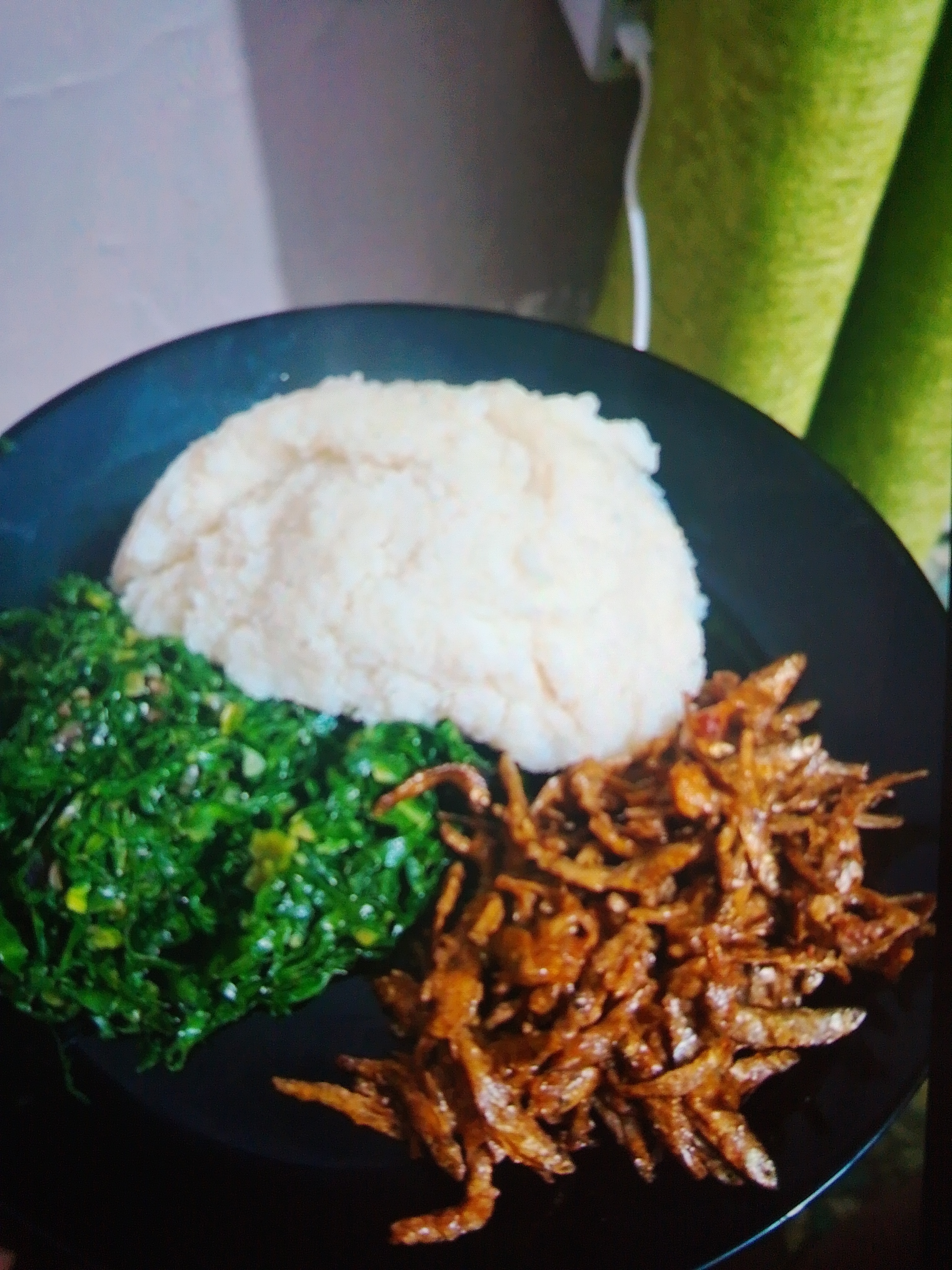 Ugali & Omena wet fry + Sukuma Wiki / cabbage .